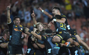 Damian McKenzie celebrates with the team
