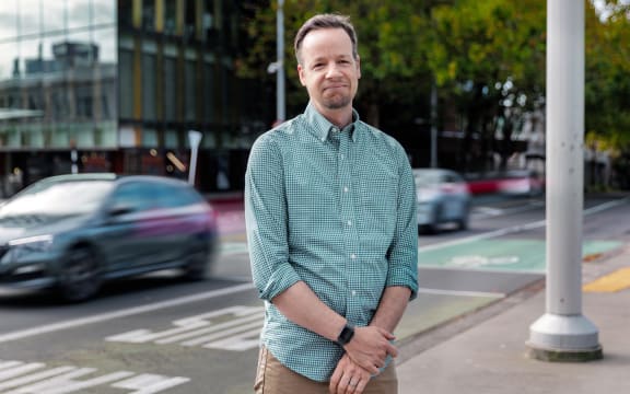 Portrait of Timothy Welch standing in a street