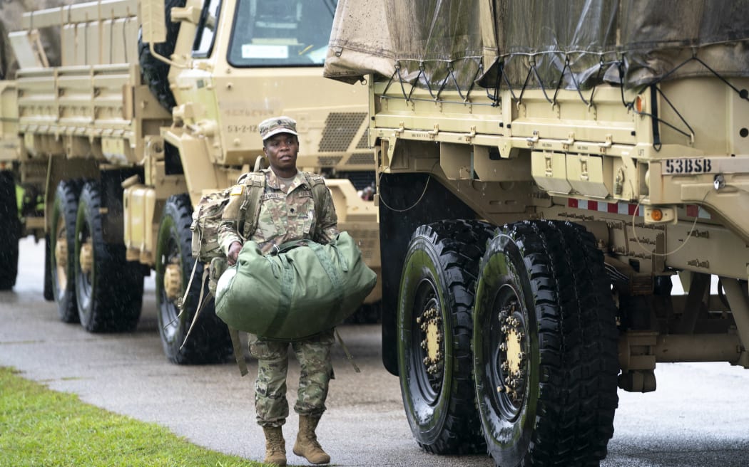 A National Guardsman prepares for storm response on 26 September, 2024 in Crawfordville, Florida, ahead of the arrival of Hurricane Helene.