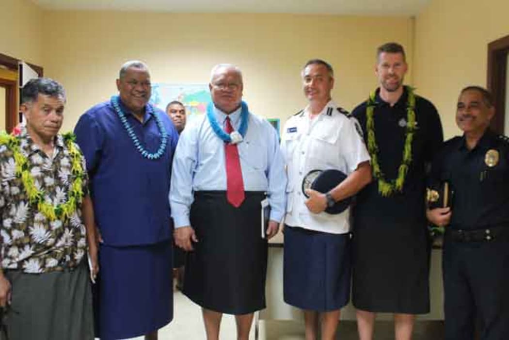 Two police commissioners in Center Le'i Sonny Thompson -Am Samoa and Fuiavailili Egon Keil-Samoa.  with AFP advisor Phil Eagles.