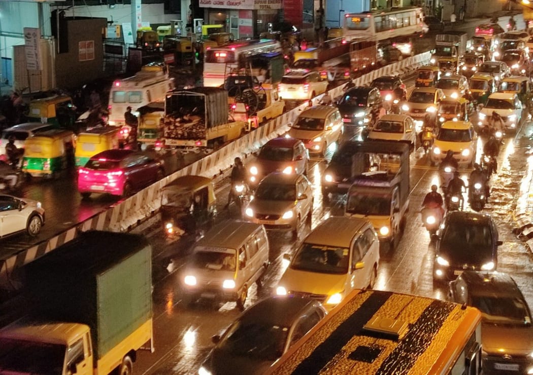 Slow moving traffic in city during festival rush and rain leading to a massive traffic jam in Bangalore, Karnataka on August 19, 2021.. The Times of India/ Syed Asif. (Photo by Syed Asif. / The Times of India / The Times of India via AFP)