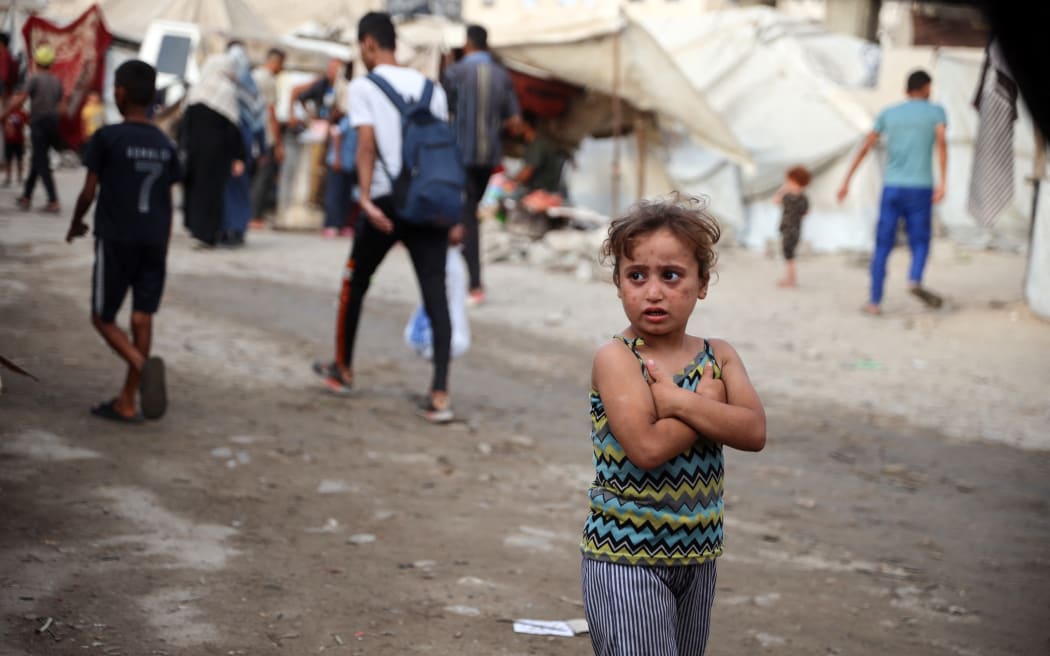 A displaced Palestinian girl walks along the Sea Road in Gaza City, Palestine, on 3 September, 2025.