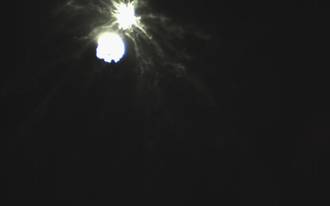 This handout picture obtained by the Italian Space Agency’s LICIACube shows the intentional collision of NASA's Double Asteroid Redirection Test (DART) mission with its target asteroid Dimorphos on 26 September 2022.