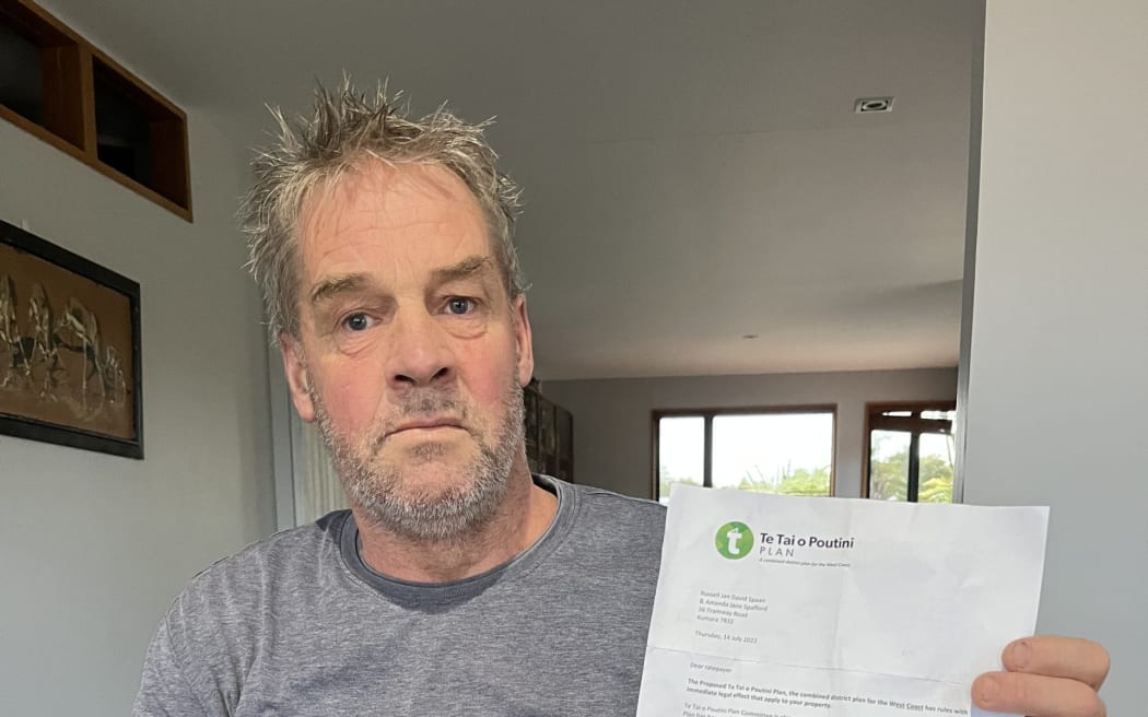 Kumara man Russell Spaan with a letter sent to him by the TTPP wrongly advising him his property had a site or area of significance to Māori.