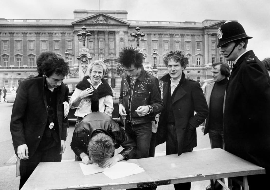 Sex Pistols signing their A&M deal outside Buckingham Palace