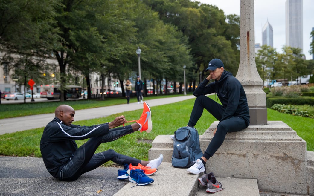 CHICAGO, UNITED STATES - OCTOBER 07: Coach Gary Lough watches as Mo Farah tries his race shoes the day before the Chicago Marathon on October 07, 2018 in Chicago, United States. This image is part of a series following Mo Farah behind the scenes in his journey towards the Tokyo Olympics. Farah is a multiple Olympic, World and European champion and Britain's most successful track athlete in modern Olympic Games history. (Photo by Michael Steele/Getty Images)