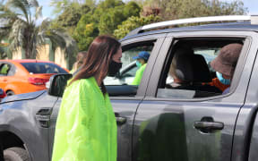 Prime Minister Jacinda Ardern speaks to people in Gisborne after they got their vaccine and are waiting in observation.