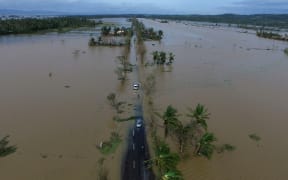 An aerial photo shows a flooded highway after typhoon Nock-Ten made landfall in Polangui, Albay province, in the Philippines.