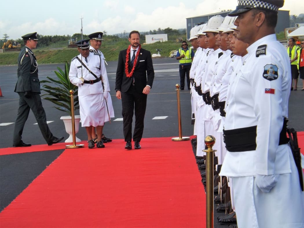 Norway Crown Prince, HRH Haakon inspects Samoa's Royal Police Guard of Honour after arriving at Faleolo International Airport.