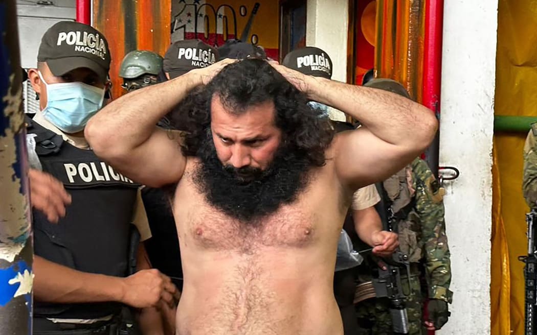 (FILES) Handout picture released by the Ecuadorean Armed Forces showing Adolfo Macias, aka Fito, leader of the Los Choneros criminal gang, while being transferred to The Rock maximum-security complex inside the Zonal Penitentiary No 8 in Guayaquil, Ecuador, during a joint operation by the Police and the Military at the facility, Ecuador, on August 12, 2023. Ecuadorean authorities are unable to find the whereabouts of alias "Fito", leader of the country's main criminal gang, imprisoned in the city of Guayaquil, the police commander said on January 7, 2024. Hundreds of uniformed officers entered penitentiary complexes in the port of Guayaquil in the morning, the first such measure taken by President Daniel Noboa, but the reason for the operation is not yet known. The media are talking about the possibility that the leader of Los Choneros, whose real name is Adolfo Macias, may have escaped.
Ecuadorean Armed Forces / AFP