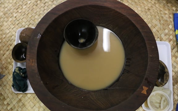 A tanoa (kava bowls) with a bilo (kava cup). Normally the lowliest person would serve kava to the circle.