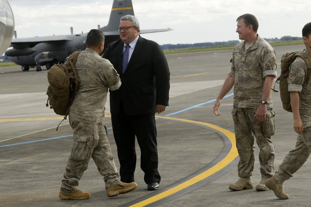 Troops returning from Iraq are welcomed by Defence Minister Gerry Brownlee and Commander Joint Forces New Zealand Major-General Tim Gall at the Ohakea Air Base on 16 November 2015.
