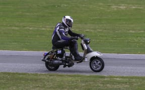 Mike Salmon in action on his Lambretta.