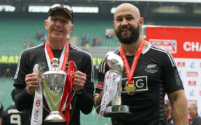 Coach Gordon Tietjens holds the IRB 7s World Series Trophy and DJ Forbes holds the London 7s Trophy after the match. 2014.