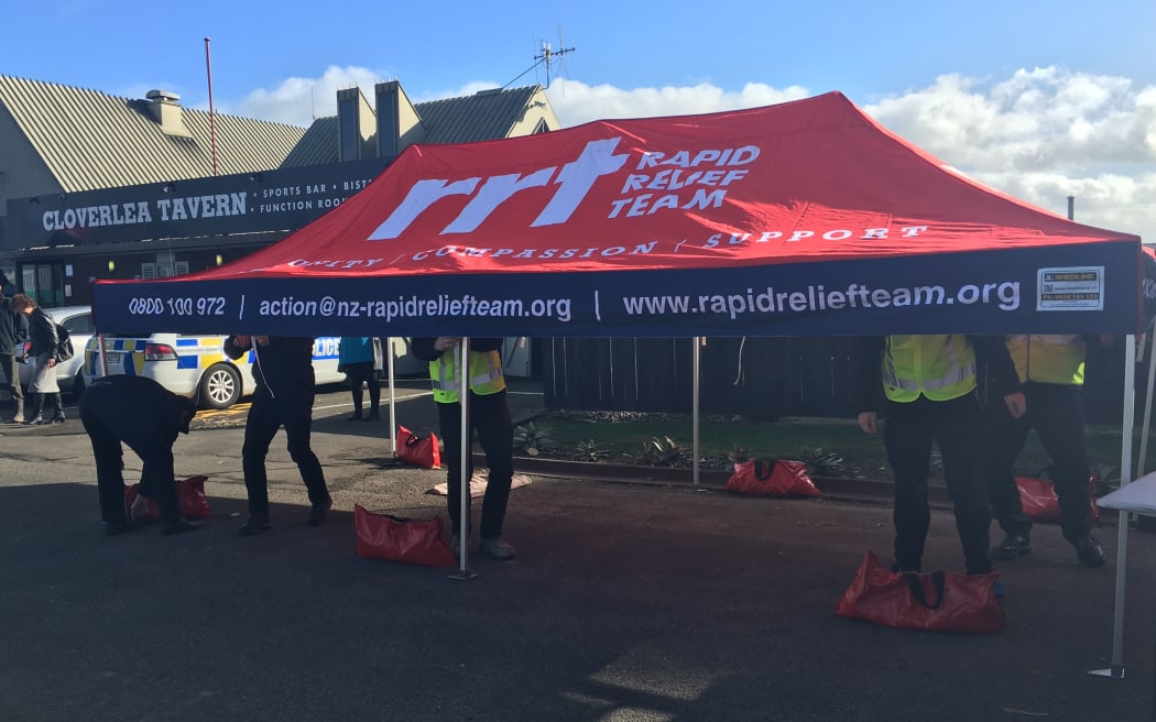 The police are encouraging a suspected gunman to give himself up, as a Palmerston North suburb remains locked down for nearly 24 hours.