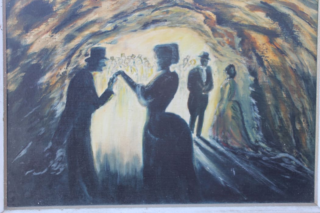 A painting of dancers in the Whatipu cave.