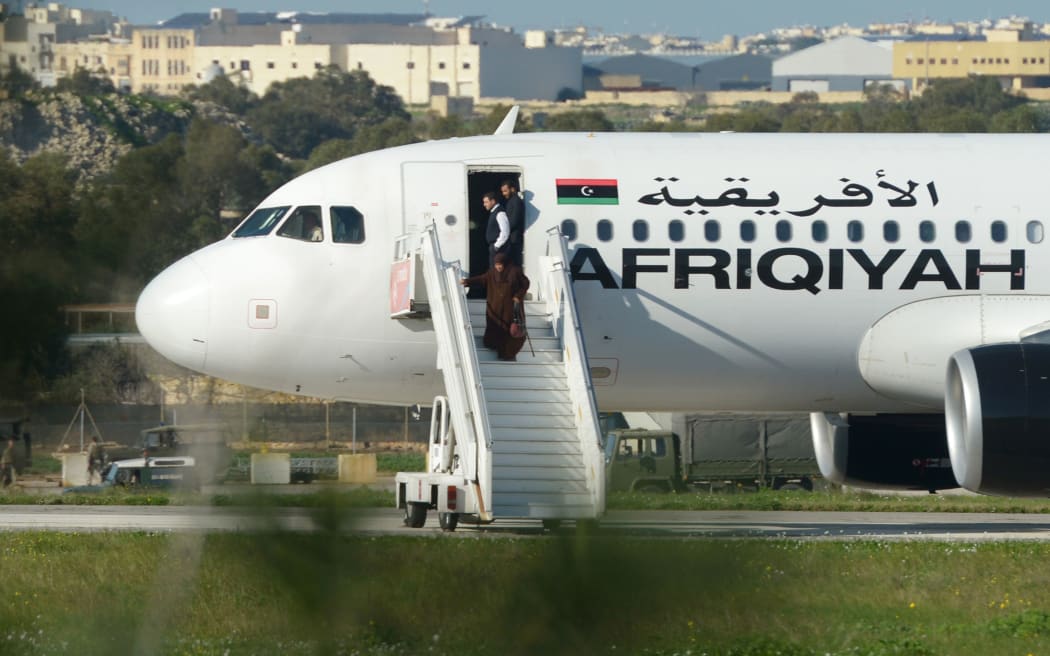 A group of hostages is released from the Afriqiyah Airways A320 after it was hijacked in Libya.