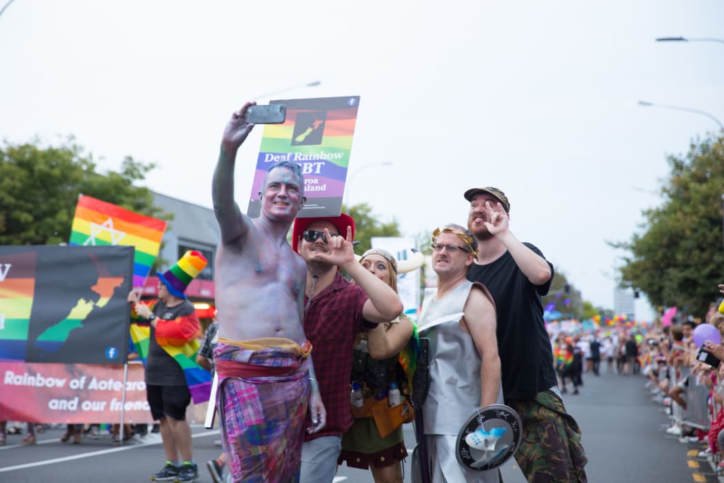 Members of the Deaf Rainbow LGBT group take a mid-parade selfie.
