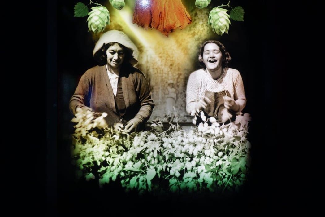 One of the lightboards in the exhibition, of hop pickers in Motueka.