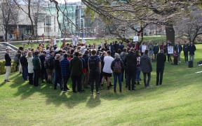 Some Otago University students protest the proctor's destruction of the magazine Critic. This week's edition depicted a pixelated image of a person menstruating.