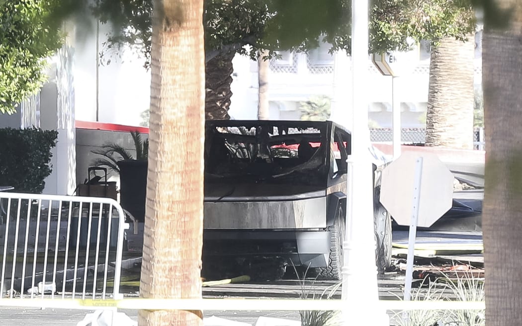 A Tesla Cybertruck is shown after it caught fire and exploded outside the lobby of President-elect Donald Trump's hotel, on January 1, 2025, in Las Vegas. - At least one person was killed and seven wounded when a Tesla Cybertruck exploded outside a hotel belonging to US President-elect Donald Trump in Las Vegas, police said Wednesday. (Photo by WADE VANDERVORT / AFP)
