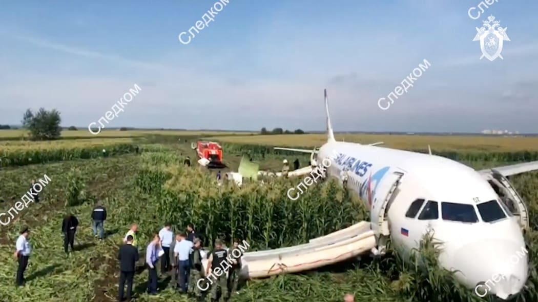 In this handout video grab released by Russian Investigative Committee, the Airbus A321, which made a hard landing in a corn field near Zhukovsky International Airport, is pictured in Moscow region, Russia.