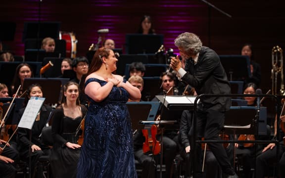 Madison Horman (soprano), NZSO National Youth Orchestra, Adam Johnson (conductor) onstage at Wellington's Michael Fowler Centre.