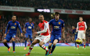 Kieran Gibbs of Arsenal in action with Paddy McNair of Manchester United in 2014.