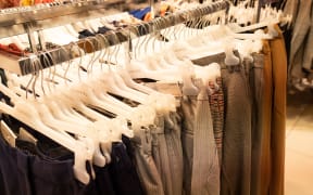 Daily life in Bretagne. Clothing racks generic
Vie quotidienne en Bretagne. (Photo by Martin Bertrand / Hans Lucas / Hans Lucas via AFP)