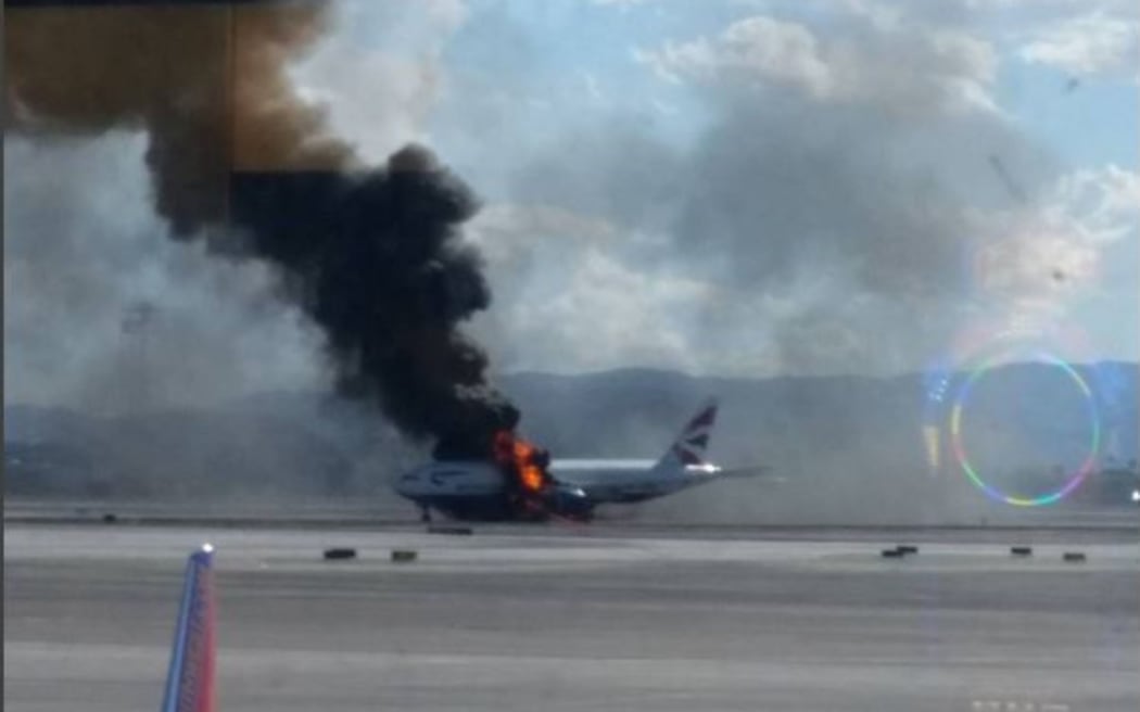A passenger plane on fire on the runway at McCarran International Airport in Las Vegas.