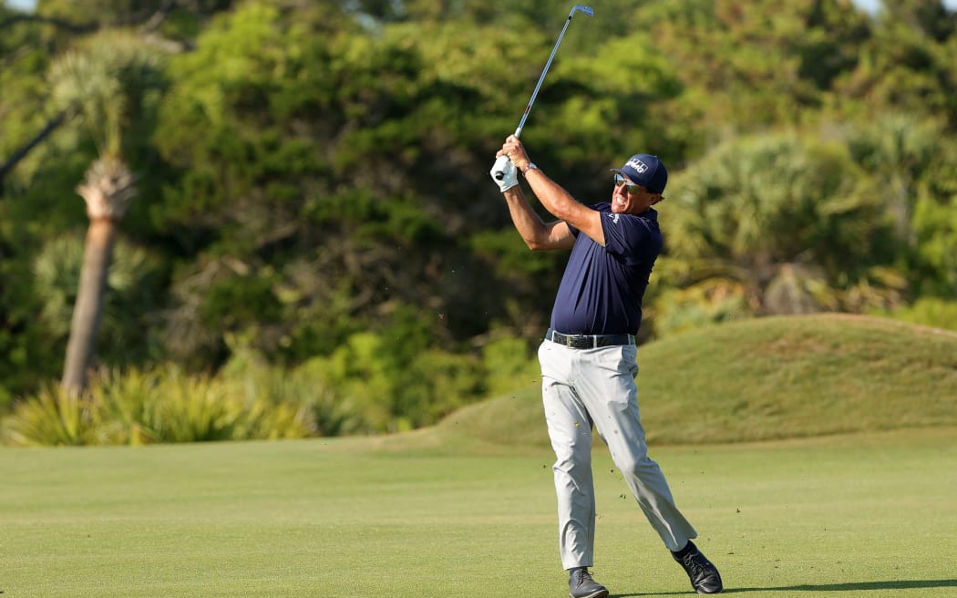 Phil Mickelson of the United States plays a second shot on the 12th hole during the final round of the 2021 PGA Championship held at the Ocean Course of Kiawah Island Golf Resort on May 23, 2021 in Kiawah Island, South Carolina.