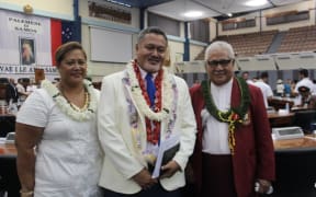 Samoa's Justice minister, Faaolesa Katopau Ainuu, (centre) with his wife Diana and the mayor of Apia.