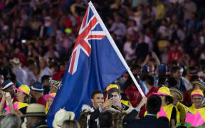 New Zealand flag bearers Blair Tuke and Peter Burling take a selfie during the opening ceremony at Maracana Stadium.