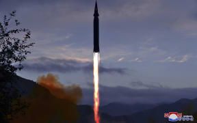 This photo, released from North Korea's official news agency, shows the Academy of Defence Science of the DPRK test-firing a Hwasong-8 hypersonic missile.