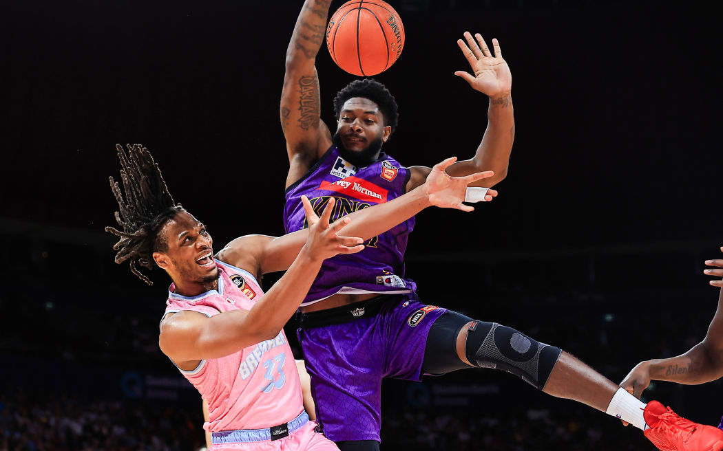 Freddie Gillespie of the Breakers (L) and Cameron Oliver of the Kings compete for a loose ball during their NBL game in Sydney.