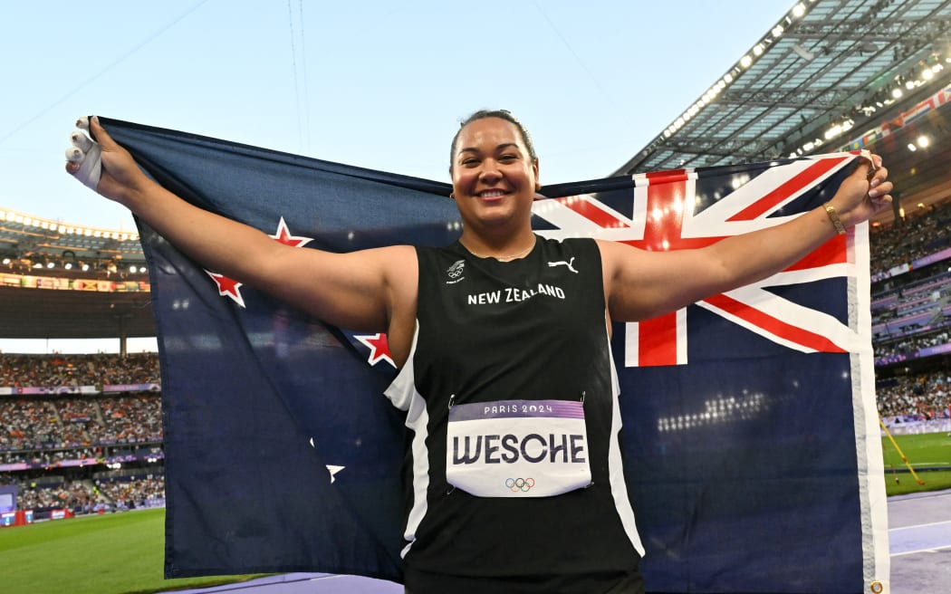 Silver medallist New Zealand's Maddison-Lee Wesche celebrates after the women's shot put final of the athletics event at the Paris 2024 Olympic Games at Stade de France in Saint-Denis, north of Paris, on August 9, 2024. (Photo by Andrej ISAKOVIC / AFP)