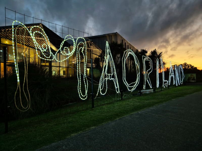 A luminous Māoriland sign outside Ngā Purapura in Ōtaki