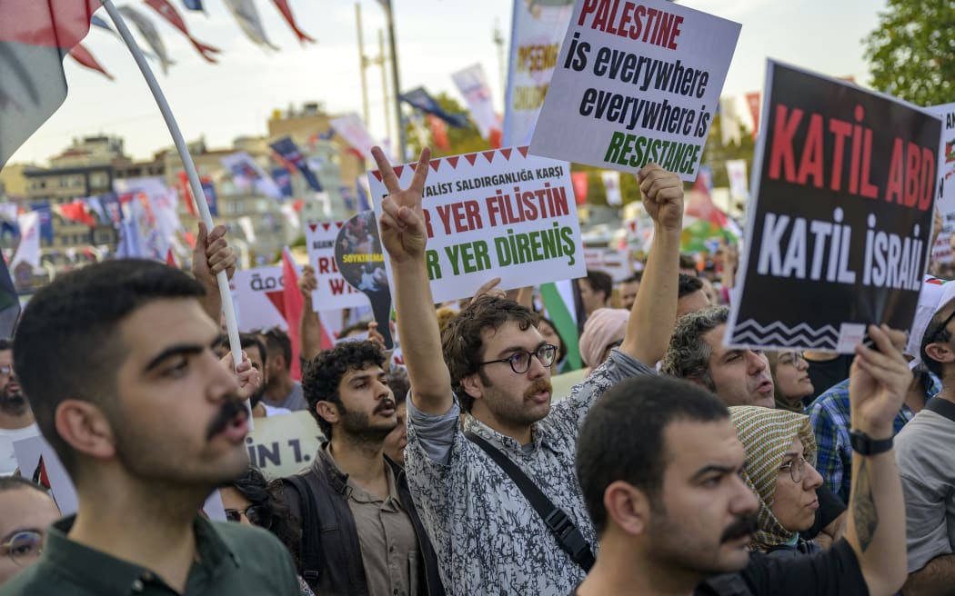 Protesters take part in a demonstration in Istanbul on October 5, 2024, against Israel's attacks on Lebanon and the ongoing war between Israel and Hamas militants in the Gaza Strip. (Photo by Yasin AKGUL / AFP)