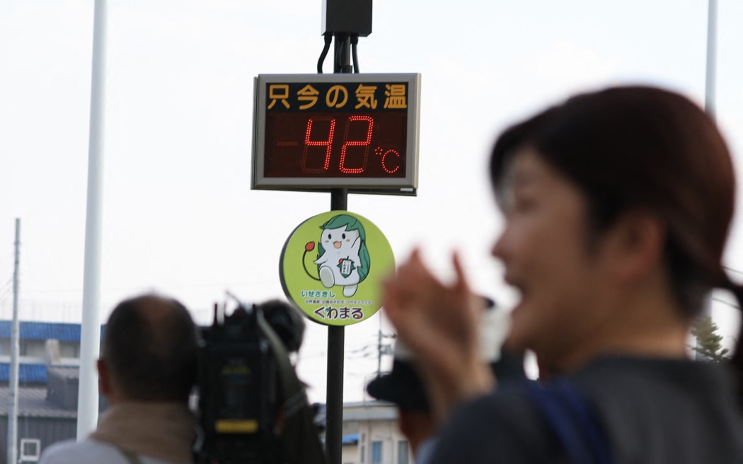 The thermometer shows 42 degrees Celsius in Isesaki City, Gunma Prefecture, Japan, on August 5, 2025.
