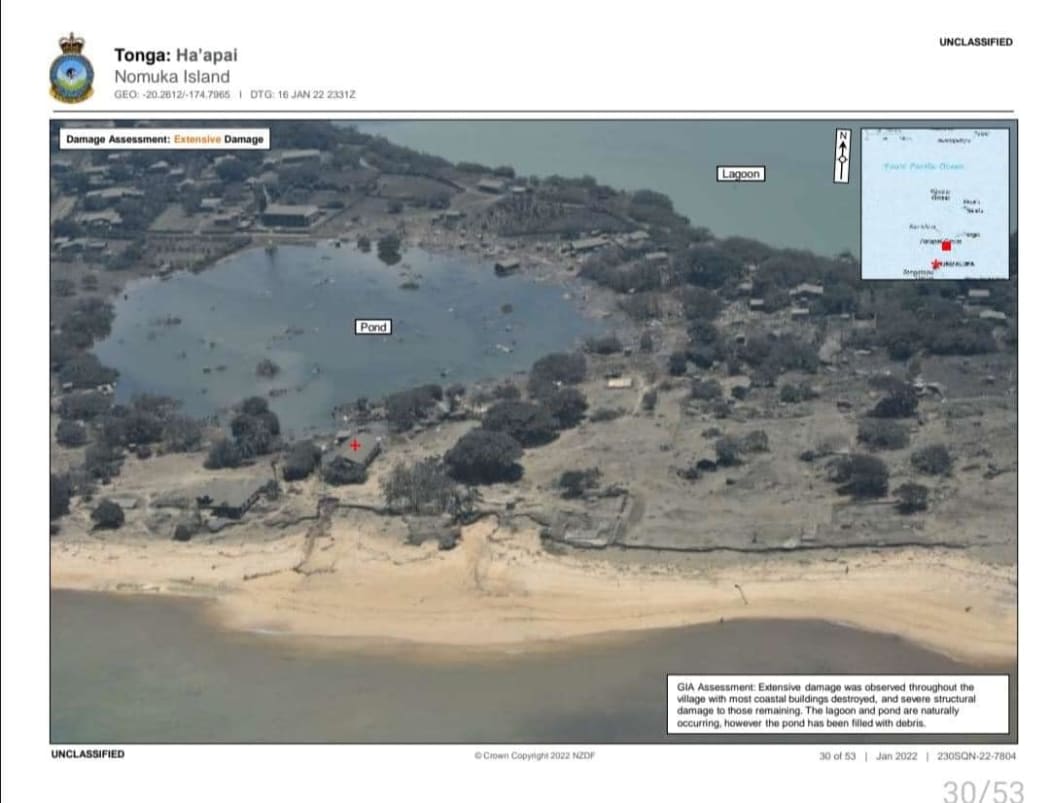 Nomuka Island in Ha'apai, Tonga, as seen from an NZDF P-3 Orion reconnaisance flight after the eruption of Hunga Tonga-Hunga Ha'apai. The image caption says extensive damage was  observed through the village with most coastal buildings destroyed.