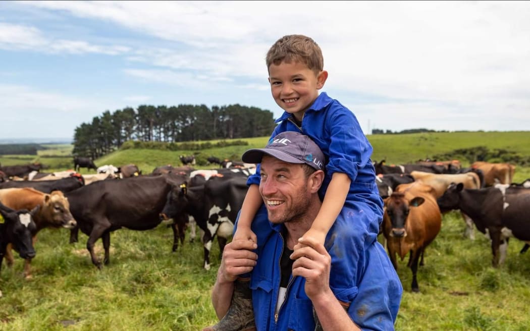 Kane on the farm with his son