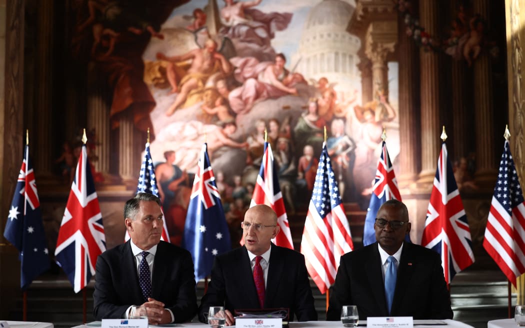(L-R) Australian Defense Minister Richard Marles, Britain's Defence Secretary John Healey and US Defense Secretary Lloyd Austin sit down for talks at the Old Royal Naval College, during the AUKUS Defense Ministerial Meeting in London on September 26, 2024. The UK, US and Australia have forged a new defence alliance in recent years dubbed AUKUS, which is seen as primarily aimed at countering China's growing military strength in the Asia-Pacific region. (Photo by HENRY NICHOLLS / AFP)