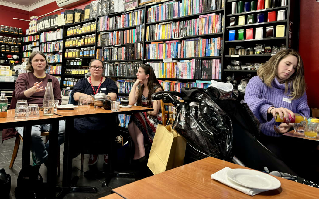 Auckland Romance Readers Book Club members discuss a book.