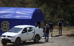 Portuguese Judicial Police (PJ) criminal investigation unit members remove equipment set near the Arade dam in Silves on May 25, 2023, after the completion of the search operation in the investigation into the disappearance of Madeleine McCann.