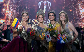 From left, Miss Colombia Andrea Aguilera, Miss Korea Mina Sue Choi, Miss Palestine Nadeen Ayoub and Miss Australia Sheridan Mortlock pose for a photo after the coronation night during the 22nd edition of the Miss Earth pageant in Manila on 29 November, 2022.