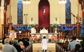 Bishop Gielen consecrates the bread and wine
