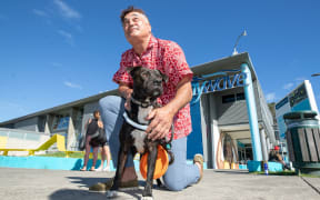 Jarrod Tumai with his dog Poto, who is no longer allowed at council pools