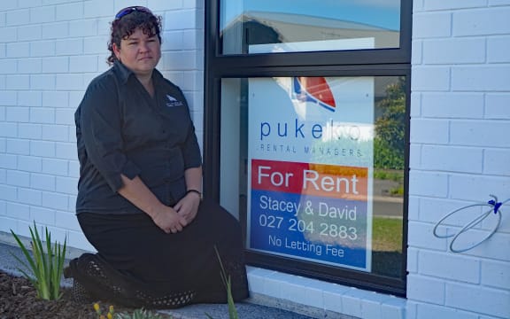 Stacey Tancred with the offending sign - now safely displayed in a window