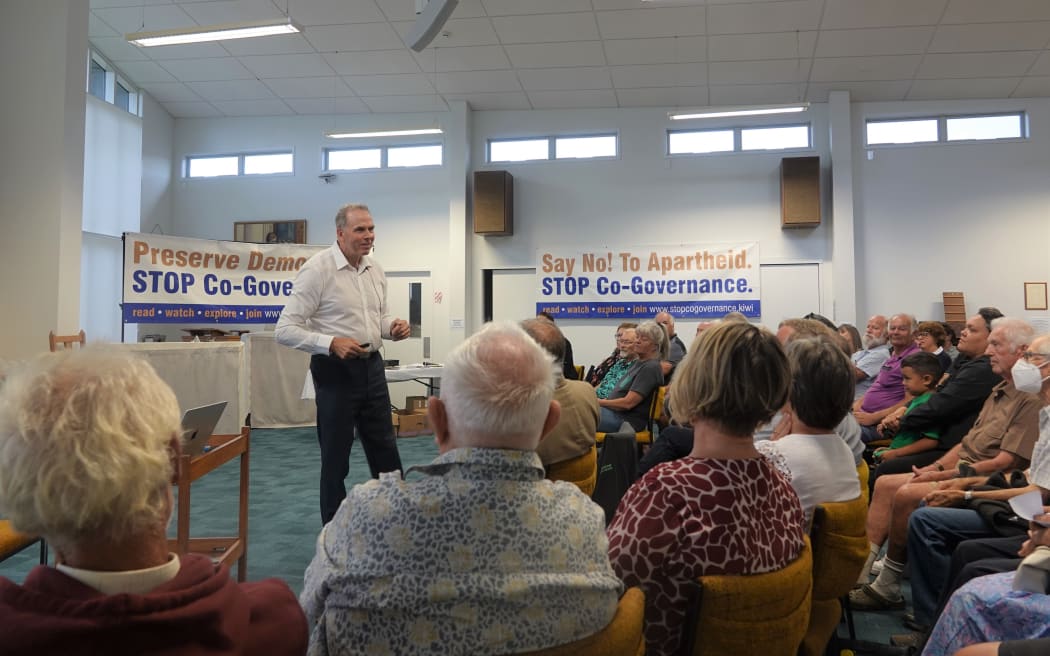 Julian Batchelor addresses mtg in Kerikeri
