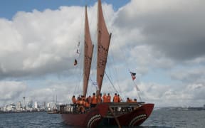 Waka Quest voyaging canoe Haunui sailing in the Waitemata Harbour.